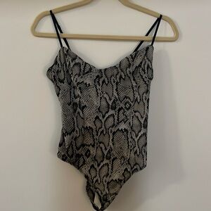 Women's black and white snakeskin bodysuit